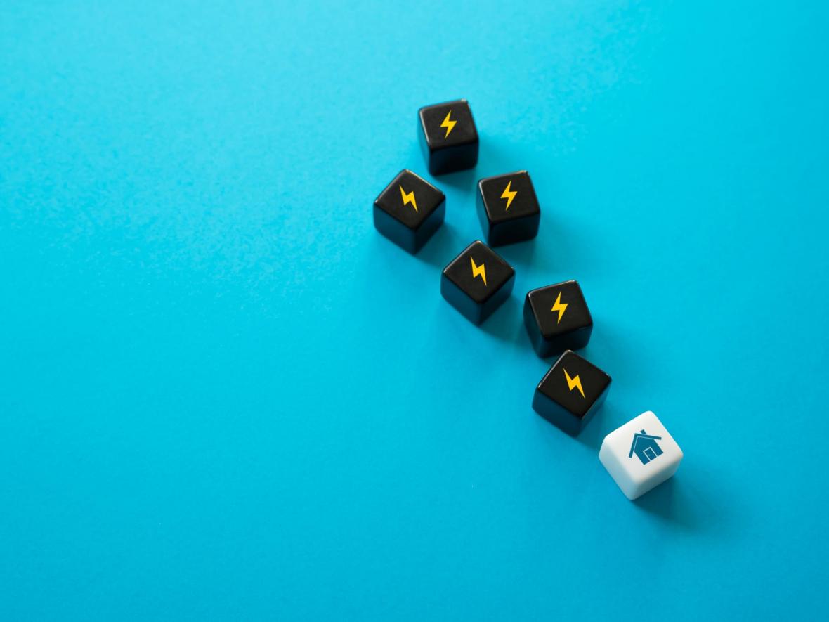 dice of electric bolt symbolizing extra power to a house