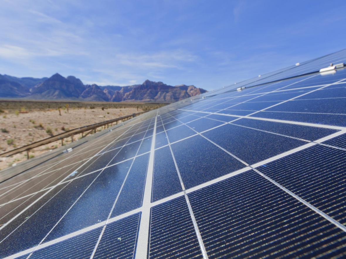 Solar panels in front of mountains 