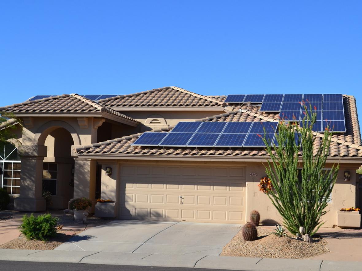 Ranch house with solar panels on the roof