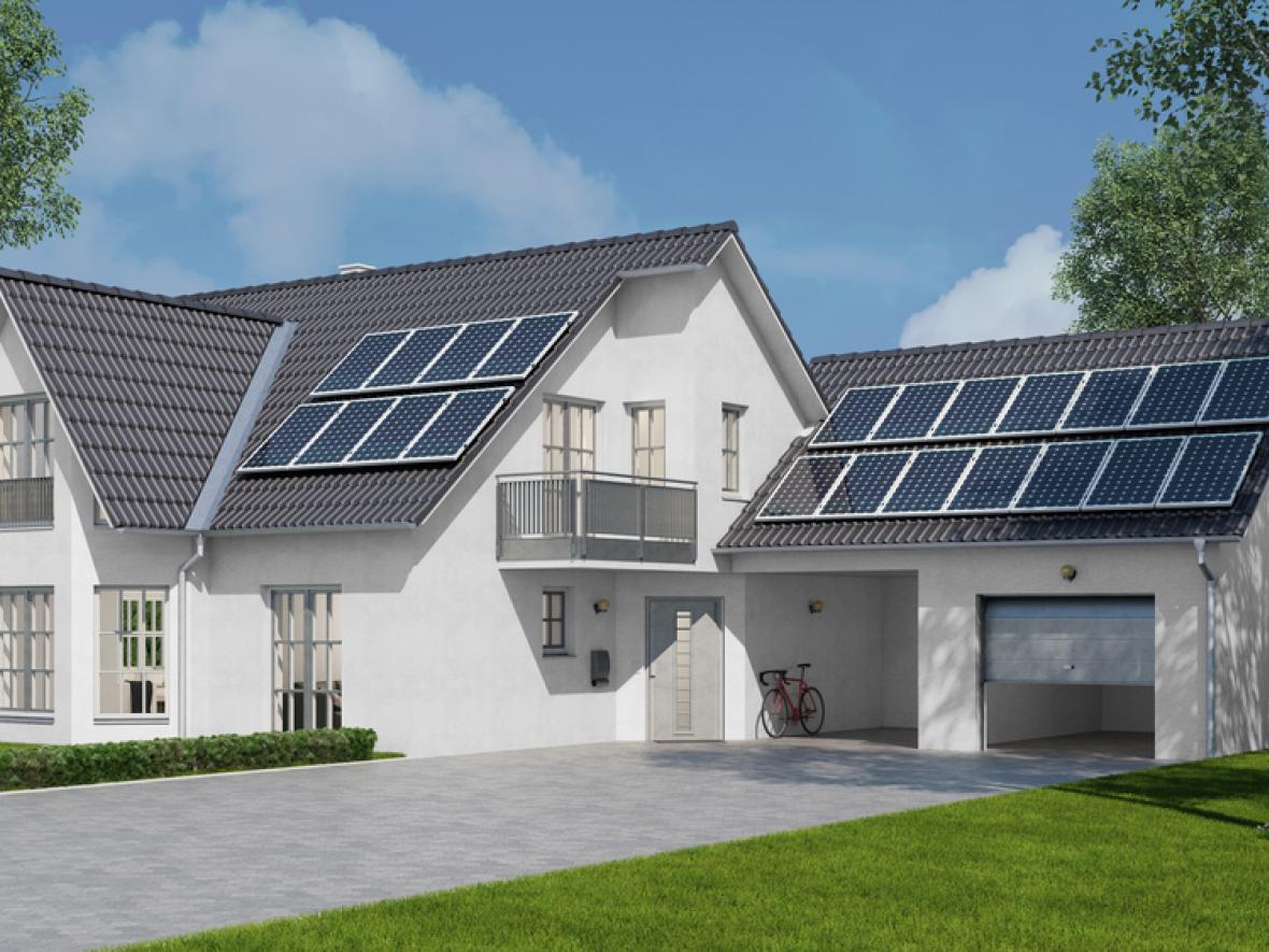 solar panels on the roof of a white house