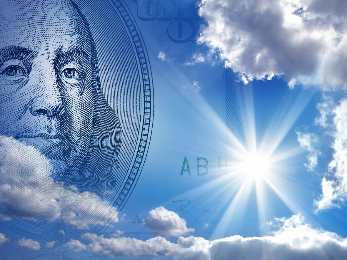 Ben Franklin $100 bill in blue sky solar