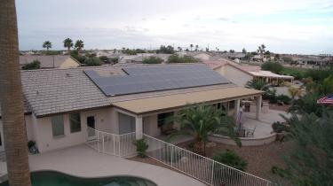 solar panel system on roof of house with pool